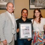 Restaurant Informer Publisher John Sawyer (left) and Editor in Chief, Christy SImo (right) present Cassidy Jones with her award.
