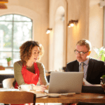 man and women going over restaurant plans
