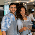 Man and woman happy at their restaurant thanks to these 5 tips for profitability